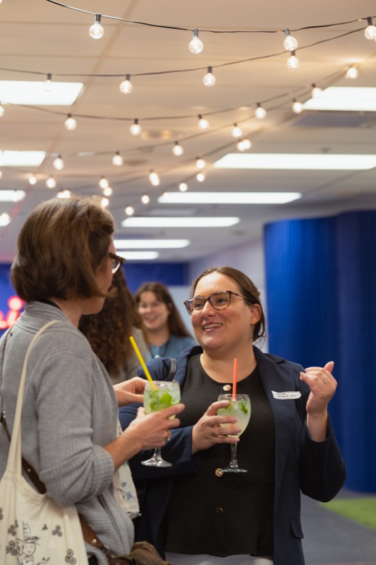 Guests chatting over mocktails
