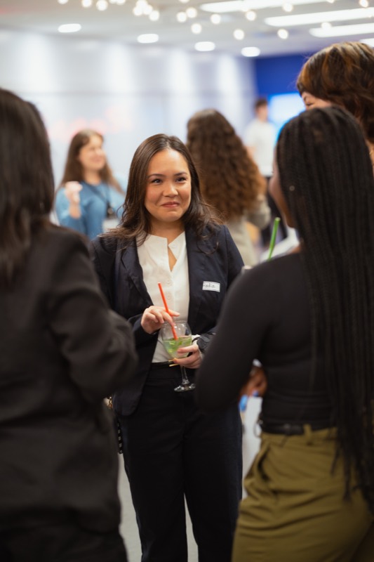 Students networking with GURU energy drinks